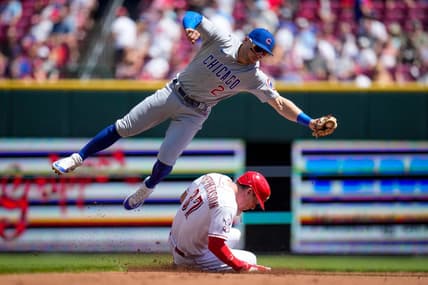 Cincinnati Reds catcher Tyler Stephenson (37) slides in safely stealing second under a tag from Chicago Cubs second baseman Nico Hoerner (2) in the second inning of an MLB National League game between the Cincinnati Reds and the Chicago Cubs at Great American Ball Park in downtown Cincinnati on Friday, Sept. 1, 2023. The first game of the doubleheader was tied 0-0 after three innings.