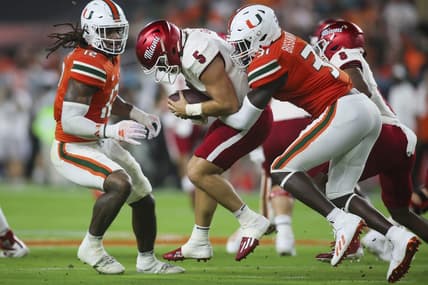 Sep 1, 2023; Miami Gardens, Florida, USA; Miami Hurricanes linebacker Wesley Bissainthe (31) sacks Miami Redhawks quarterback Brett Gabbert (5) during the second quarter at Hard Rock Stadium. Mandatory Credit: Sam Navarro-USA TODAY Sports