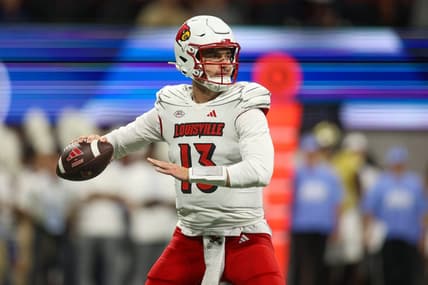 Sep 1, 2023; Atlanta, Georgia, USA; Louisville Cardinals quarterback Jack Plummer (13) looks to throw against the Georgia Tech Yellow Jackets in the second quarter at Mercedes-Benz Stadium. Mandatory Credit: Brett Davis-USA TODAY Sports