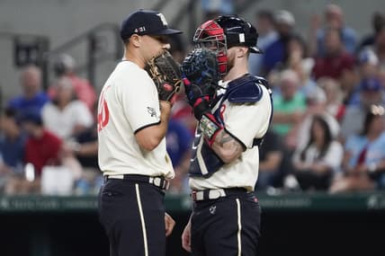 Sep 1, 2023; Arlington, Texas, USA; Texas Rangers relief pitcher Brock Burke (46) and Texas Rangers catcher Jonah Heim (28) talk on mound between pitches against the Minnesota Twins at Globe Life Field. Mandatory Credit: Raymond Carlin III-USA TODAY Sports