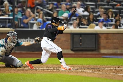 Sep 1, 2023; New York City, New York, USA;  New York Mets shortstop Francisco Lindor (12) hits a single against the Seattle Mariners during the eighth inning at Citi Field. Mandatory Credit: Gregory Fisher-USA TODAY Sports