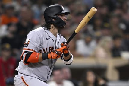 Sep 1, 2023; San Diego, California, USA; San Francisco Giants shortstop Brandon Crawford (35) hits a sacrifice fly against the San Diego Padres during the fourth inning at Petco Park. Mandatory Credit: Orlando Ramirez-USA TODAY Sports