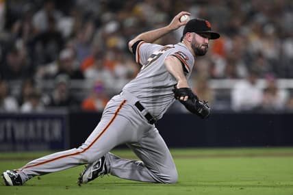 Sep 1, 2023; San Diego, California, USA; San Francisco Giants relief pitcher Alex Wood (57) throws to first base on a ground out by San Diego Padres designated hitter Manny Machado (not pictured) during the fifth inning at Petco Park. Mandatory Credit: Orlando Ramirez-USA TODAY Sports