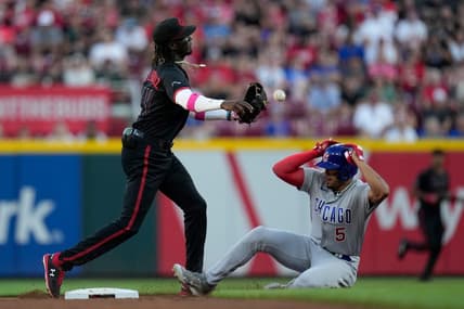 Chicago Cubs designated hitter Christopher Morel (5) slides under a double play throw by Cincinnati Reds shortstop Elly De La Cruz (44) in the second inning of an MLB National League game between the Cincinnati Reds and the Chicago Cubs at Great American Ball Park in downtown Cincinnati on Friday, Sept. 1, 2023. The Reds won 3-2 on a walk-off single off the bat of third baseman Noelvi Marte, scoring Stuart Fairchild from third base.