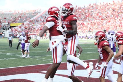 Sep 2, 2023; Little Rock, Arkansas, USA; Arkansas Razorbacks quarterback KJ Jefferson (1) and wide receiver Andrew Armstrong (2) celebrate after a touchdown against the Western Carolina Catamounts at War Memorial Stadium. Arkansas won 56-13. Mandatory Credit: Nelson Chenault-USA TODAY Sports