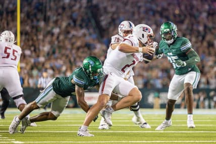 Sep 2, 2023; New Orleans, Louisiana, USA;  South Alabama Jaguars quarterback Carter Bradley (2) scrambles out the pocket to avoid the sack of Tulane Green Wave safety Kam Pedescleaux (8) during the first half at Yulman Stadium. Mandatory Credit: Stephen Lew-USA TODAY Sports