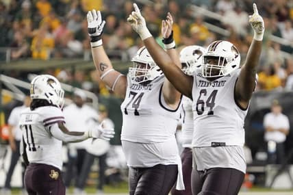 Sep 2, 2023; Waco, Texas, USA; Texas State Bobcats offensive lineman Caleb Johnson (74) and offensive lineman Dorion Strawn (64) celebrate a touchdown against the Baylor Bears during the second half at McLane Stadium. Mandatory Credit: Raymond Carlin III-USA TODAY Sports