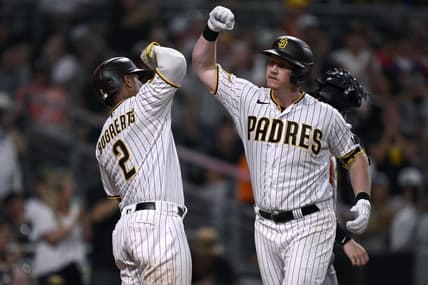 Sep 2, 2023; San Diego, California, USA; San Diego Padres first baseman Garrett Cooper (right) is congratulated by shortstop Xander Bogaerts (2) after hitting a three-run home run against the San Francisco Giants during the sixth inning at Petco Park. Mandatory Credit: Orlando Ramirez-USA TODAY Sports