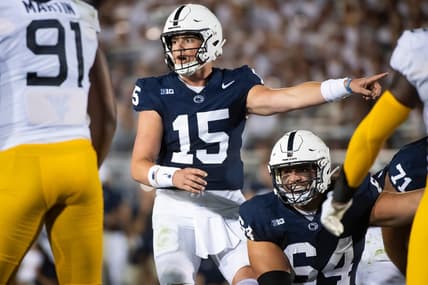 Penn State quarterback Drew Allar (15) and center Hunter Nourzad (64) point out a detail in the West Virginia defense during the season opener at Beaver Stadium September 2, 2023, in State College.