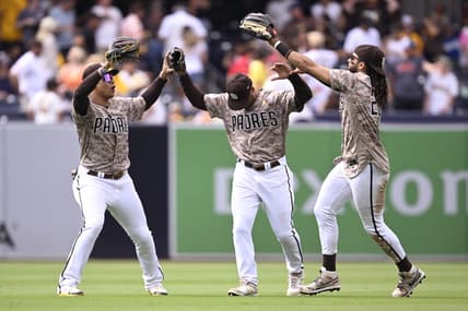 Sep 3, 2023; San Diego, California, USA; San Diego Padres left fielder Juan Soto (22) celebrates with center fielder Trent Grisham (1) and right fielder Fernando Tatis Jr. (23) after defeating the San Francisco Giants at Petco Park. Mandatory Credit: Orlando Ramirez-USA TODAY Sports