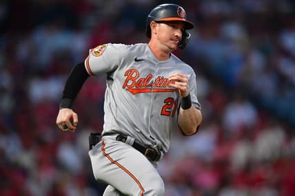 Sep 4, 2023; Anaheim, California, USA; Baltimore Orioles left fielder Austin Hays (21) hits an RBI double against the Los Angeles Angels during the third inning at Angel Stadium. Mandatory Credit: Gary A. Vasquez-USA TODAY Sports