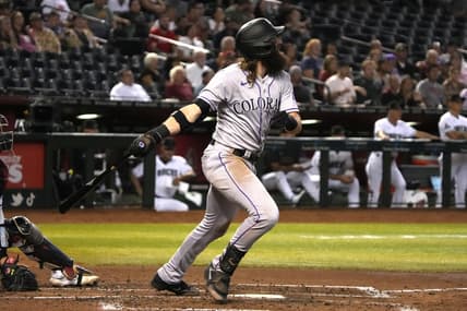 Sep 5, 2023; Phoenix, Arizona, USA; Colorado Rockies designated hitter Charlie Blackmon (19) hits an RBI sacrifice fly out against the Arizona Diamondbacks in the fourth inning at Chase Field. Mandatory Credit: Rick Scuteri-USA TODAY Sports