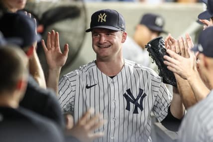 Sep 6, 2023; Bronx, New York, USA;  New York Yankees starting pitcher Clarke Schmidt (36) is greeted in the dugout after being taken out in the seventh inning against the Detroit Tigers at Yankee Stadium. Mandatory Credit: Wendell Cruz-USA TODAY Sports