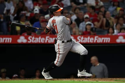 Sep 6, 2023; Anaheim, California, USA;  Baltimore Orioles left fielder Austin Hays (21) hits an RBI single during the third inning against the Los Angeles Angels at Angel Stadium. Mandatory Credit: Kiyoshi Mio-USA TODAY Sports