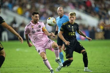 Sep 3, 2023; Los Angeles, California, USA; Inter Miami CF forward Lionel Messi (10) and LAFC midfielder Mateusz Bogusz (19) battle for the ball at BMO Stadium. Mandatory Credit: Kirby Lee-USA TODAY Sports