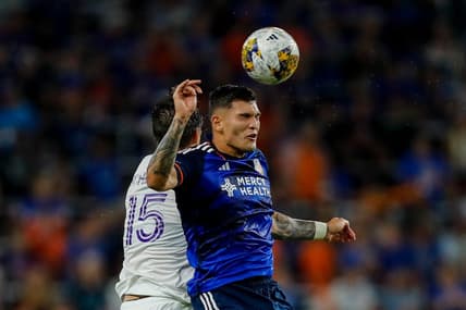 Sep 2, 2023; Cincinnati, Ohio, USA; FC Cincinnati forward Brandon Vazquez (19) heads the ball against Orlando City SC defender Rodrigo Schlegel (15) in the second half at TQL Stadium. Mandatory Credit: Katie Stratman-USA TODAY Sports