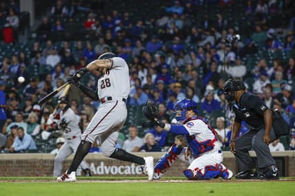 Sep 7, 2023; Chicago, Illinois, USA; Arizona Diamondbacks left fielder Tommy Pham (28) hits a solo home run against the Chicago Cubs during the first inning at Wrigley Field. Mandatory Credit: Kamil Krzaczynski-USA TODAY Sports