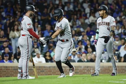 Sep 7, 2023; Chicago, Illinois, USA; Arizona Diamondbacks left fielder Tommy Pham (28) celebrates with first baseman Christian Walker (53) after hitting a two-run home run against the Chicago Cubs during the eight inning at Wrigley Field. Mandatory Credit: Kamil Krzaczynski-USA TODAY Sports
