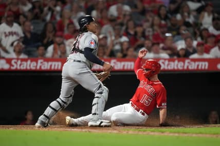 Sep 8, 2023; Anaheim, California, USA; Los Angeles Angels left fielder Randal Grichuk (15) slides into home plate to beat a throw to Cleveland Guardians catcher Bo Naylor (23) to score in the fourth inning at Angel Stadium. Mandatory Credit: Kirby Lee-USA TODAY Sports