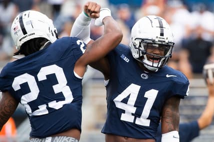 Penn State linebackers Kobe King (41) and Curtis Jacobs (23) get pumped up before facing off against Delaware Saturday, Sept. 9, 2023, in State College, Pa.