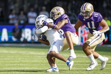 Sep 9, 2023; Seattle, Washington, USA; Washington Huskies cornerback Davon Banks (6) tackles Tulsa Golden Hurricane wide receiver Marquis Shoulders (4) following a second quarter reception at Alaska Airlines Field at Husky Stadium. Mandatory Credit: Joe Nicholson-USA TODAY Sports