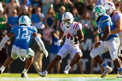 Sep 9, 2023; New Orleans, Louisiana, USA;  Mississippi Rebels running back Quinshon Judkins (4) rushes against Tulane Green Wave defensive back DJ Douglas (12) during the second half at Yulman Stadium. Mandatory Credit: Stephen Lew-USA TODAY Sports