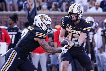Sep 9, 2023; Columbia, Missouri, USA; Missouri Tigers quarterback Brady Cook (12) hands off to running back Cody Schrader (7) against the Middle Tennessee Blue Raiders during the first half at Faurot Field at Memorial Stadium. Mandatory Credit: Denny Medley-USA TODAY Sports