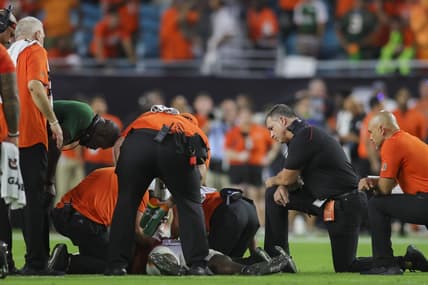 Sep 9, 2023; Miami Gardens, Florida, USA; Miami Hurricanes head coach Mario Cristobal looks on as trainers check on Miami Hurricanes safety Kamren Kinchens (5) after an injury against the Texas A&M Aggies during the fourth quarter at Hard Rock Stadium. Mandatory Credit: Sam Navarro-USA TODAY Sports