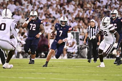 Sep 9, 2023; Starkville, Mississippi, USA; Arizona Wildcats quarterback Jayden de Laura (7) runs the ball against the Mississippi State Bulldogs during the second quarter at Davis Wade Stadium at Scott Field. Mandatory Credit: Matt Bush-USA TODAY Sports