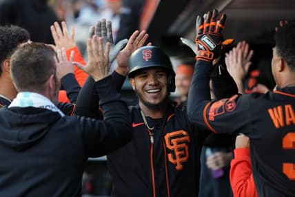 Sep 9, 2023; San Francisco, California, USA; San Francisco Giants second baseman Thairo Estrada (center) is congratulated by teammates after hitting a home run against the Colorado Rockies during the first inning at Oracle Park. Mandatory Credit: Darren Yamashita-USA TODAY Sports
