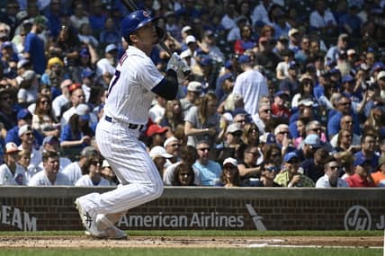 Sep 10, 2023; Chicago, Illinois, USA;  Chicago Cubs right fielder Seiya Suzuki (27) hits an RBI double against the Arizona Diamondbacks during the first inning at Wrigley Field. Mandatory Credit: Matt Marton-USA TODAY Sports