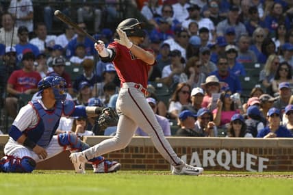 Sep 10, 2023; Chicago, Illinois, USA;  Arizona Diamondbacks center fielder Alek Thomas (5) hits an RBI sacrifice fly ball against the Chicago Cubs during the sixth inningat Wrigley Field. Mandatory Credit: Matt Marton-USA TODAY Sports
