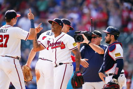 Sep 10, 2023; Cumberland, Georgia, USA; Atlanta Braves relief pitcher Raisel Iglesias (26) celebrates with Atlanta Braves third baseman Austin Riley (27) after winning 5-2 against the Pittsburgh Pirates at Truist Park. Mandatory Credit: John David Mercer-USA TODAY Sports