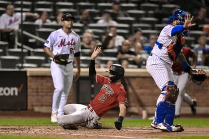 Sep 11, 2023; New York City, New York, USA; Arizona Diamondbacks left fielder Lourdes Gurriel Jr. (12) scores on a sacrifice fly hit by Arizona Diamondbacks third baseman Emmanuel Rivera (not pictured) during the fourth inning against the New York Mets at Citi Field. Mandatory Credit: John Jones-USA TODAY Sports