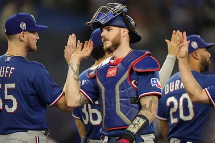 Sep 11, 2023; Toronto, Ontario, CAN; Texas Rangers catcher Jonah Heim (28) gets congratulated after a win over the Toronto Blue Jays at Rogers Centre. Mandatory Credit: John E. Sokolowski-USA TODAY Sports
