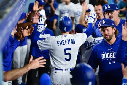 Sep 12, 2023; Los Angeles, California, USA; Los Angeles Dodgers first baseman Freddie Freeman (5) is greeted after hitting a two run home run against the San Diego Padres during the third inning at Dodger Stadium. Mandatory Credit: Gary A. Vasquez-USA TODAY Sports