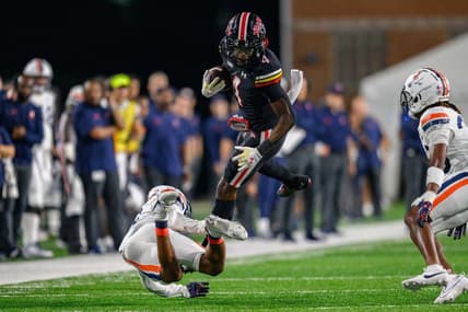 Sep 15, 2023; College Park, Maryland, USA; Maryland Terrapins wide receiver Shaleak Knotts (4) is tackled during the second quarter against the Virginia Cavaliers at SECU Stadium. Mandatory Credit: Reggie Hildred-USA TODAY Sports