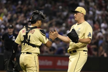 Sep 15, 2023; Phoenix, Arizona, USA; Arizona Diamondbacks catcher Gabriel Moreno (14) and pitcher Paul Sewald (38) celebrate after defeating the Chicago Cubs at Chase Field. Mandatory Credit: Rick Scuteri-USA TODAY Sports