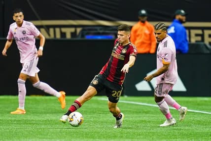 Sep 16, 2023; Atlanta, Georgia, USA; Atlanta United midfielder Matheus Rossetto (20) dribbles the ball against Inter Miami CF defender DeAndre Yedlin (2) during the first half at Mercedes-Benz Stadium. Mandatory Credit: John David Mercer-USA TODAY Sports