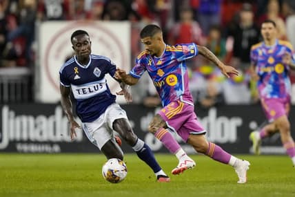 Sep 16, 2023; Toronto, Ontario, CAN; Toronto FC forward Lorenzo Insigne (24) moves the ball against Vancouver Whitecaps defender Richie Laryea (7) during the first half at BMO Field. Mandatory Credit: Kevin Sousa-USA TODAY Sports