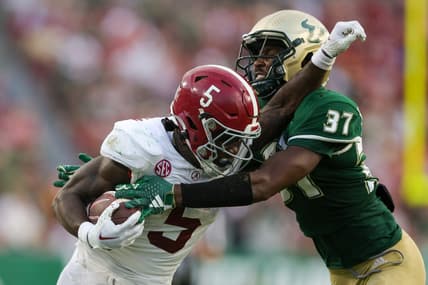Sep 16, 2023; Tampa, Florida, USA;  Alabama Crimson Tide running back Roydell Williams (5) is tackled by South Florida Bulls safety Logan Berryhill (37) in the third quarter at Raymond James Stadium. Mandatory Credit: Nathan Ray Seebeck-USA TODAY Sports