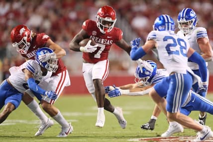Sep 16, 2023; Fayetteville, Arkansas, USA; Arkansas Razorbacks running back Rashod Dubinion (7) rushes in the second quarter against the BYU Cougars at Donald W. Reynolds Razorback Stadium. Mandatory Credit: Nelson Chenault-USA TODAY Sports
