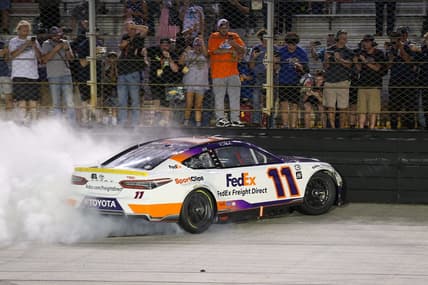 Sep 16, 2023; Bristol, Tennessee, USA; NASCAR Cup Series driver Denny Hamlin (11) does a burnout after winning the Bass Pro Shops Night Race at Bristol Motor Speedway. Mandatory Credit: Randy Sartin-USA TODAY Sports