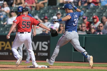 Sep 17, 2023; Cleveland, Ohio, USA; Cleveland Guardians relief pitcher Matt Moore (55) forces out Texas Rangers first baseman Nathaniel Lowe (30) during the seventh inning at Progressive Field. Mandatory Credit: Ken Blaze-USA TODAY Sports