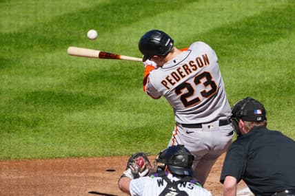 Sep 17, 2023; Denver, Colorado, USA;  San Francisco Giants designated hitter Joc Pederson (23) hits a RBI double in the sixth inning against the Colorado Rockies at Coors Field. Mandatory Credit: Ron Chenoy-USA TODAY Sports