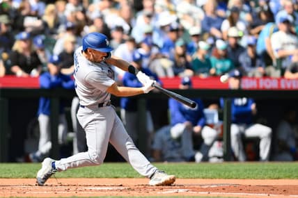 Sep 17, 2023; Seattle, Washington, USA; Los Angeles Dodgers catcher Austin Barnes (15) hits a 2-run home run against the Seattle Mariners during the second inning at T-Mobile Park. Mandatory Credit: Steven Bisig-USA TODAY Sports