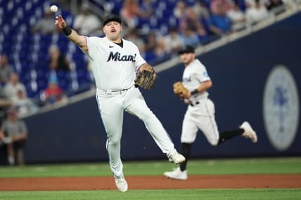 Sep 19, 2023; Miami, Florida, USA;  Miami Marlins third baseman Jake Burger (36) throws out New York Mets catcher Francisco Alvarez at first base in the first inning at loanDepot Park. Mandatory Credit: Jim Rassol-USA TODAY Sports