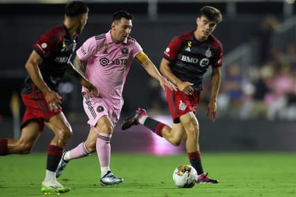 Sep 20, 2023; Fort Lauderdale, Florida, USA; Inter Miami forward Lionel Messi (10) kicks the ball past Toronto FC during the first half at DRV PNK Stadium. Mandatory Credit: Sam Navarro-USA TODAY Sports