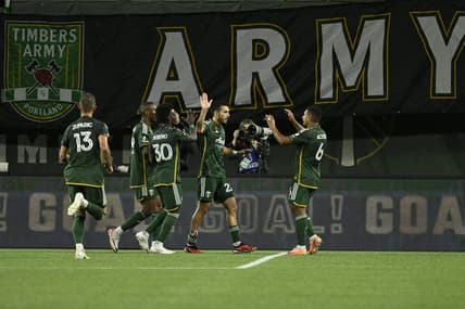 Sep 20, 2023; Portland, Oregon, USA;  Portland Timbers midfielder Cristhian Paredes (22) celebrates with teammates after scoring against San Jose Earthquakes during the first half at Providence Park. Mandatory Credit: Troy Wayrynen-USA TODAY Sports