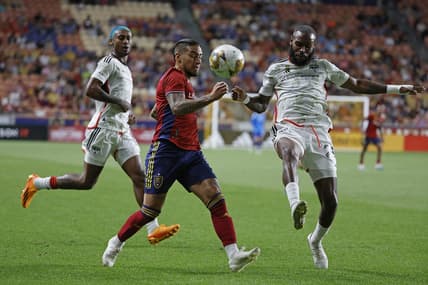 Sep 20, 2023; Sandy, Utah, USA; FC Dallas defender Sebastien Ibeagha (25) clears the ball from Real Salt Lake forward Chicho Arango (9) in the first half at America First Field. Mandatory Credit: Jeff Swinger-USA TODAY Sports